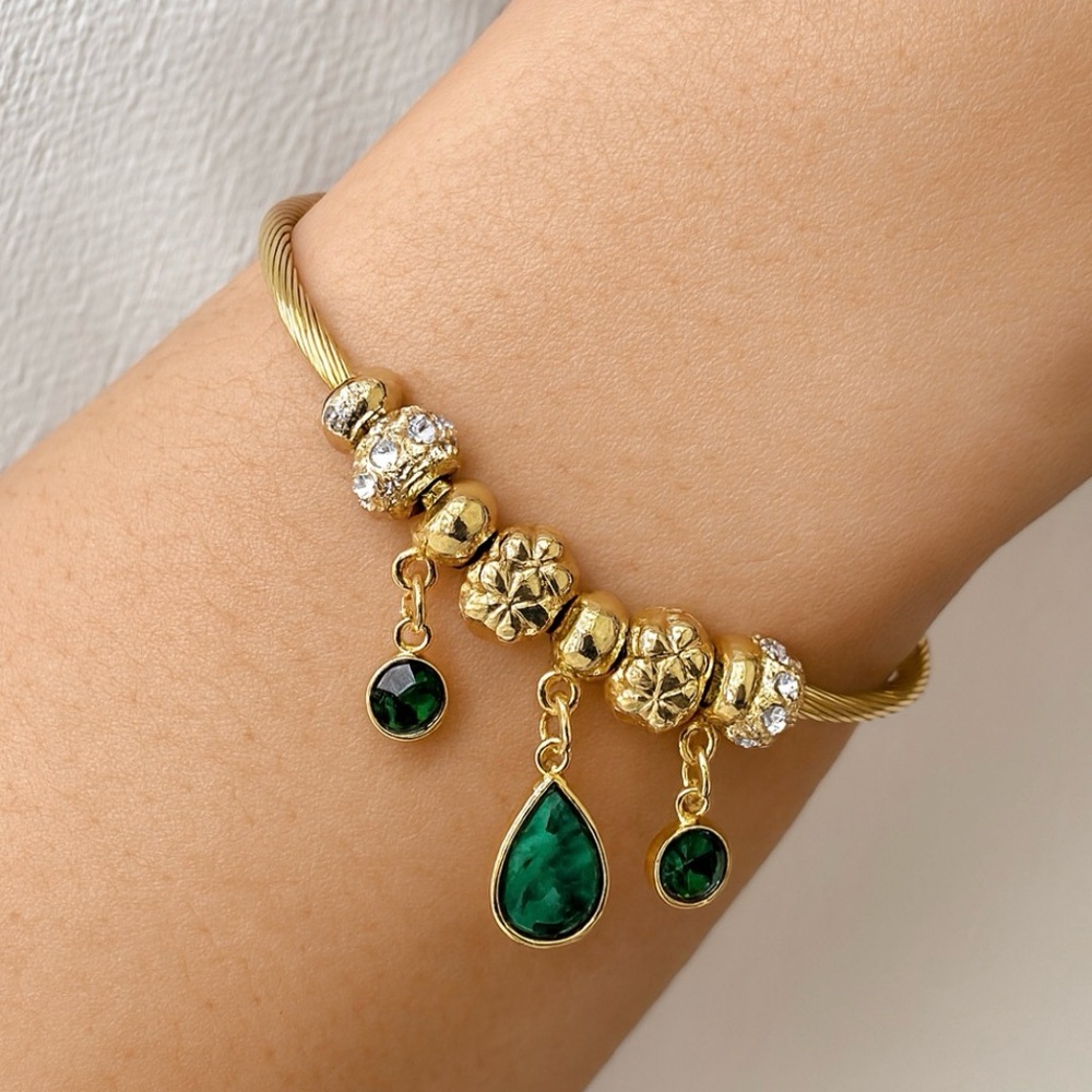 Nine West Gold tone with green pear stone dangle charms. New
